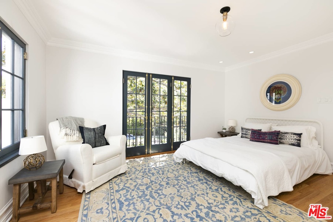 2529 North Commonwealth Avenue Los Angeles, CA 90027 - Photo 20 of 37 a bedroom with a bed and a large window