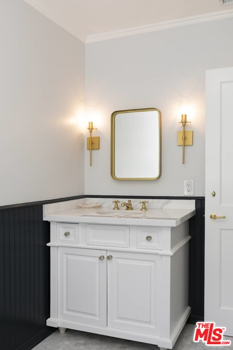 2529 North Commonwealth Avenue Los Angeles, CA 90027 - Photo 22 of 37 a bathroom with a sink vanity and a mirror