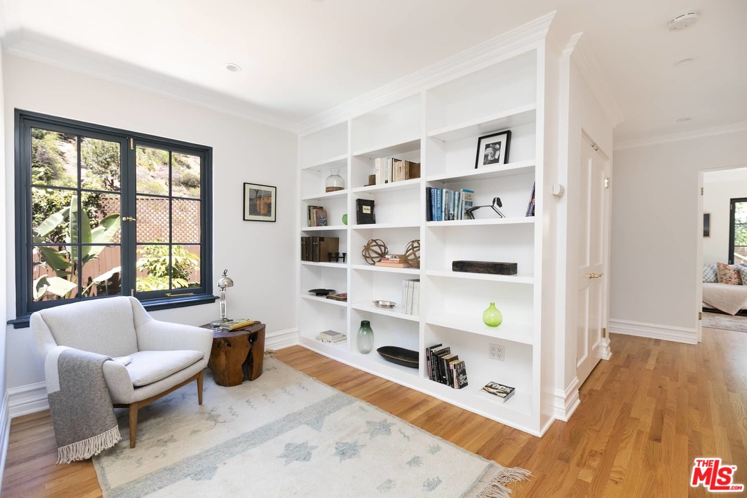 2529 North Commonwealth Avenue Los Angeles, CA 90027 - Photo 24 of 37 a living room with furniture cabinets and window