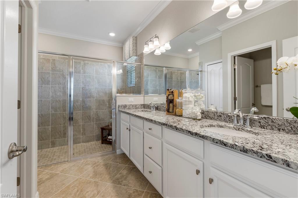 16100 Bonita Landing Circle Bonita Springs, FL 34135 - Photo 16 of 28 a bathroom with a granite countertop sink mirror and shower