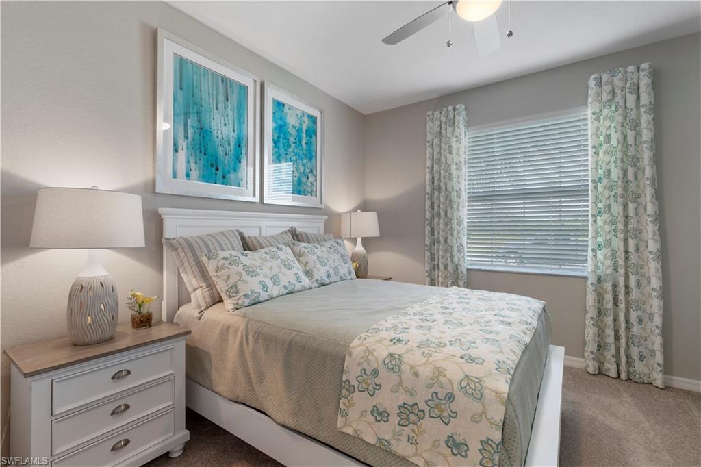 16100 Bonita Landing Circle Bonita Springs, FL 34135 - Photo 18 of 28 a bedroom with a large bed and a window
