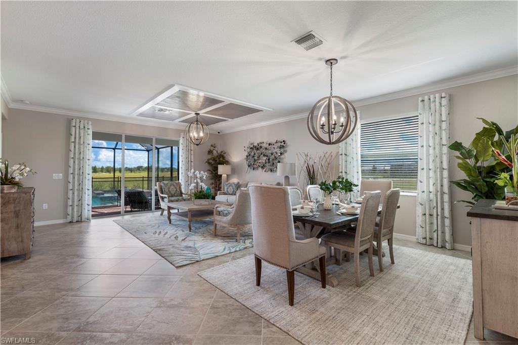 16100 Bonita Landing Circle Bonita Springs, FL 34135 - Photo 4 of 28 a dining room with furniture a livingroom and chandelier