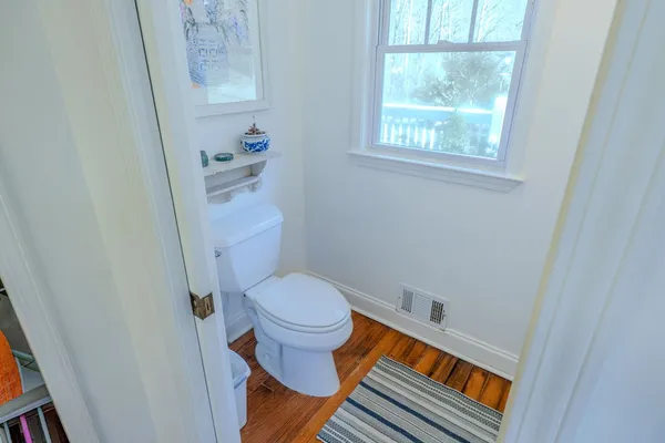 a bathroom with a toilet and a bathtub