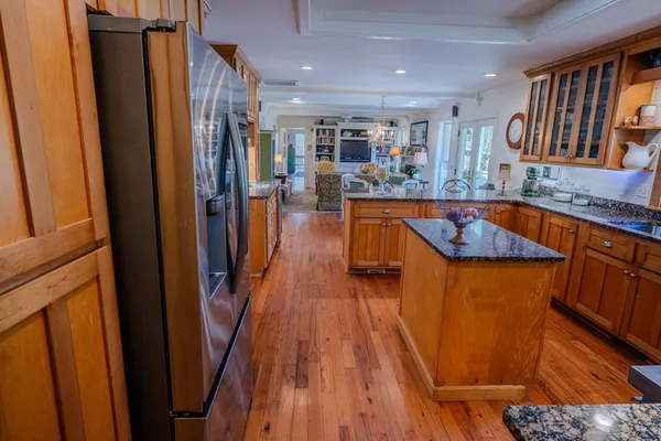 a bathroom with a sink vanity mirror and toilet