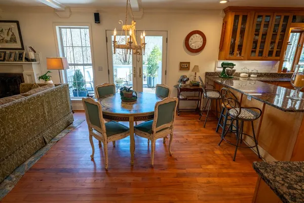 a living room filled with furniture and a potted plant