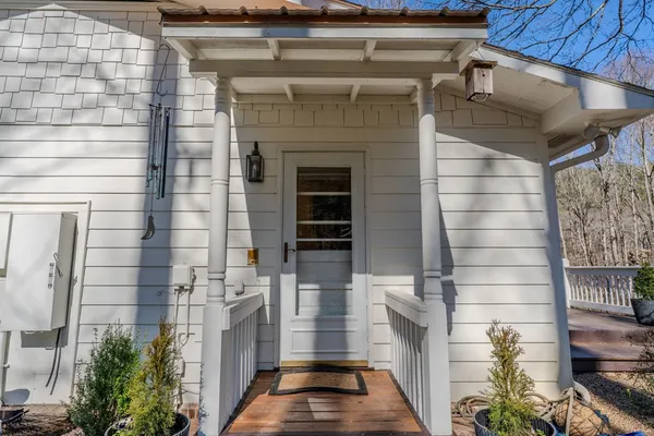 a view of a workspace with furniture and wooden floor