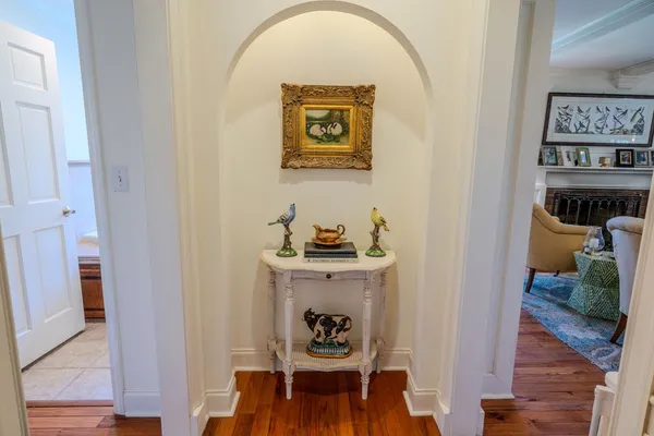 a bathroom with a toilet and a shower curtain