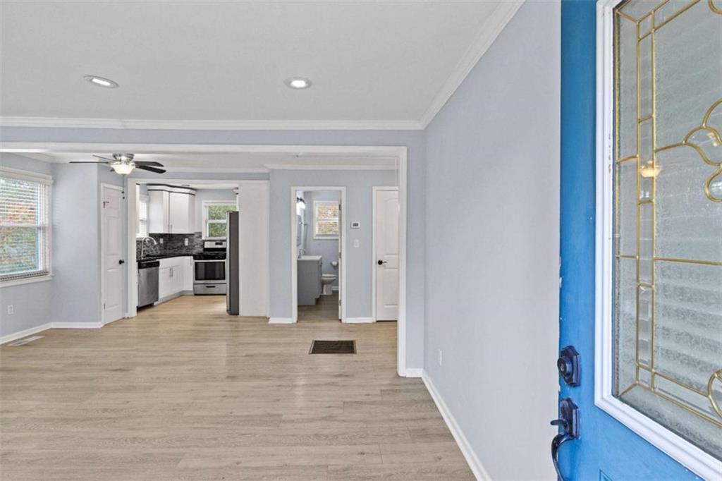 701 Daniel Avenue Decatur, GA 30032 - Photo 16 of 29 a view of a hallway with wooden floor and a bathroom