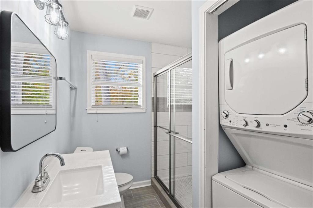 701 Daniel Avenue Decatur, GA 30032 - Photo 25 of 29 a bathroom with a sink a toilet and a mirror