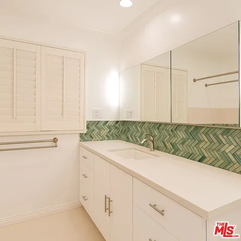 a bathroom with a sink and vanity