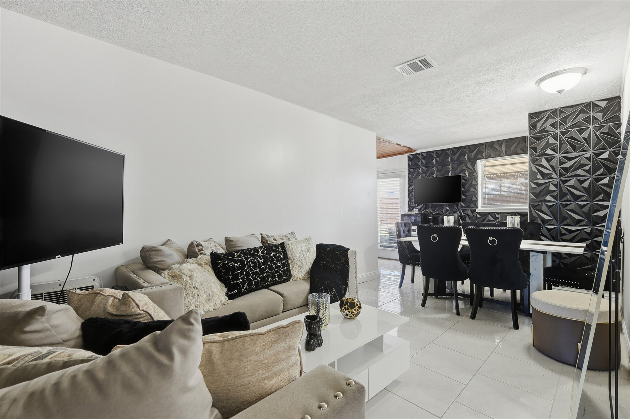 2205 Strawberry Road Pasadena, TX 77502 - Photo 12 of 29 a living room with furniture and a flat screen tv