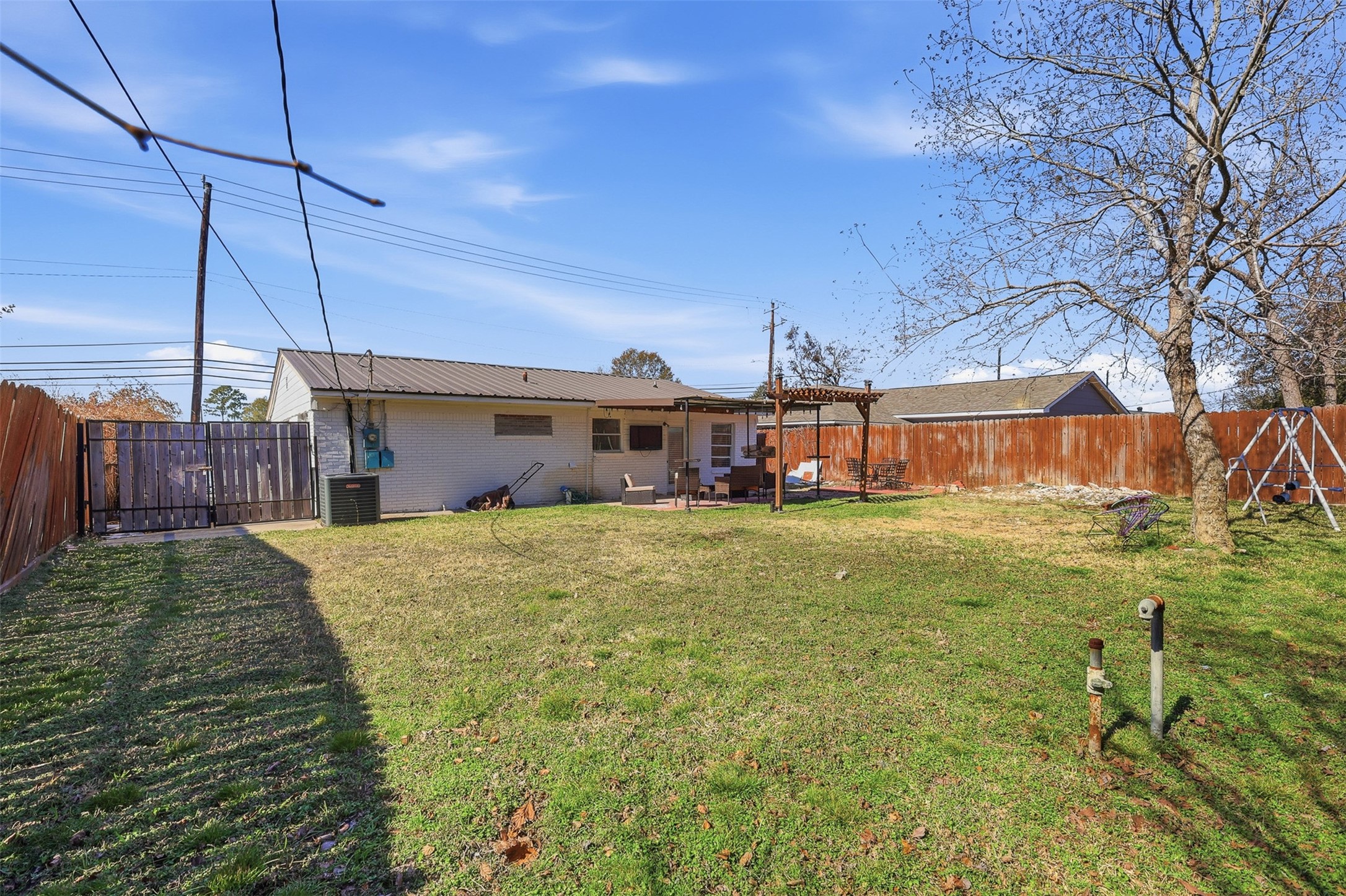 2205 Strawberry Road Pasadena, TX 77502 - Photo 23 of 29 a view of a house with a yard