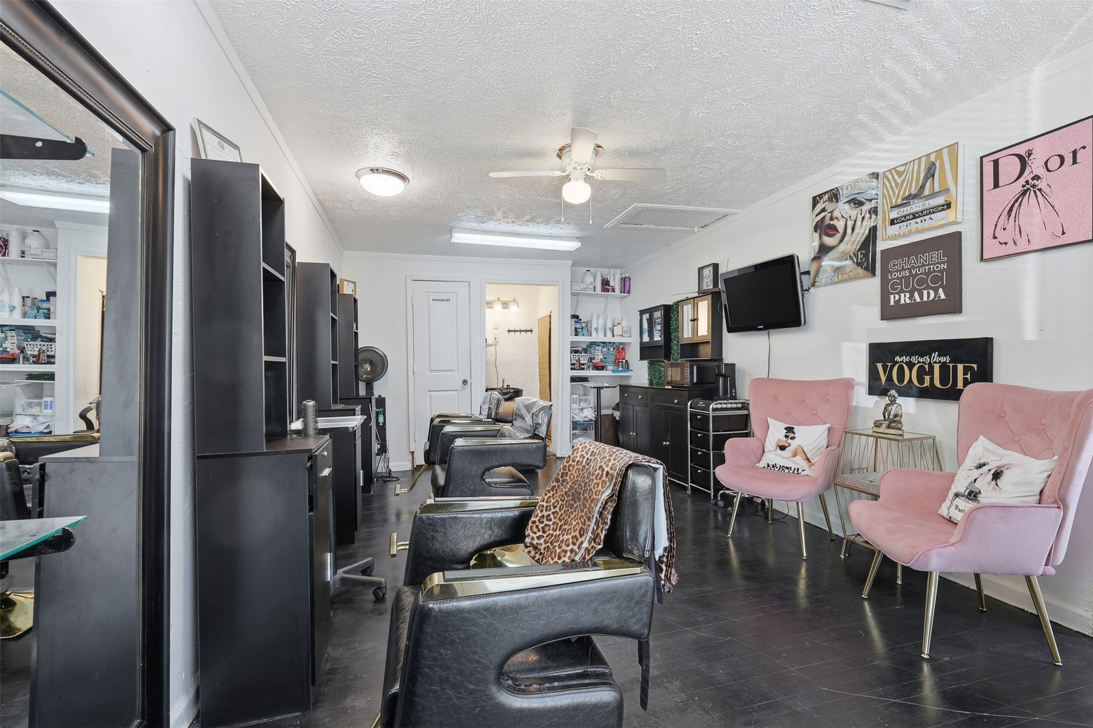 2205 Strawberry Road Pasadena, TX 77502 - Photo 5 of 29 a living room with furniture a flat screen tv and a refrigerator