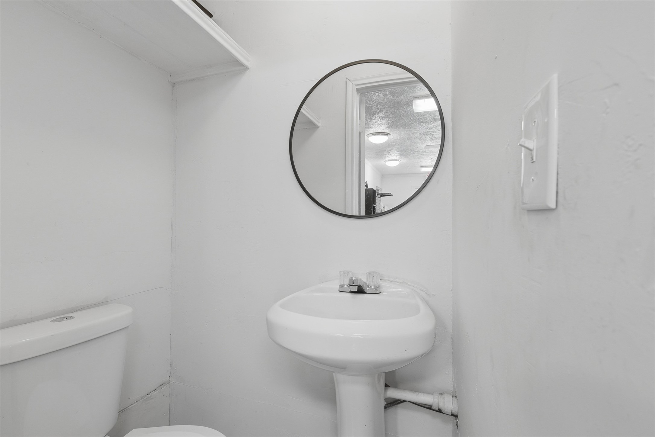 2205 Strawberry Road Pasadena, TX 77502 - Photo 7 of 29 a bathroom with a sink and a mirror