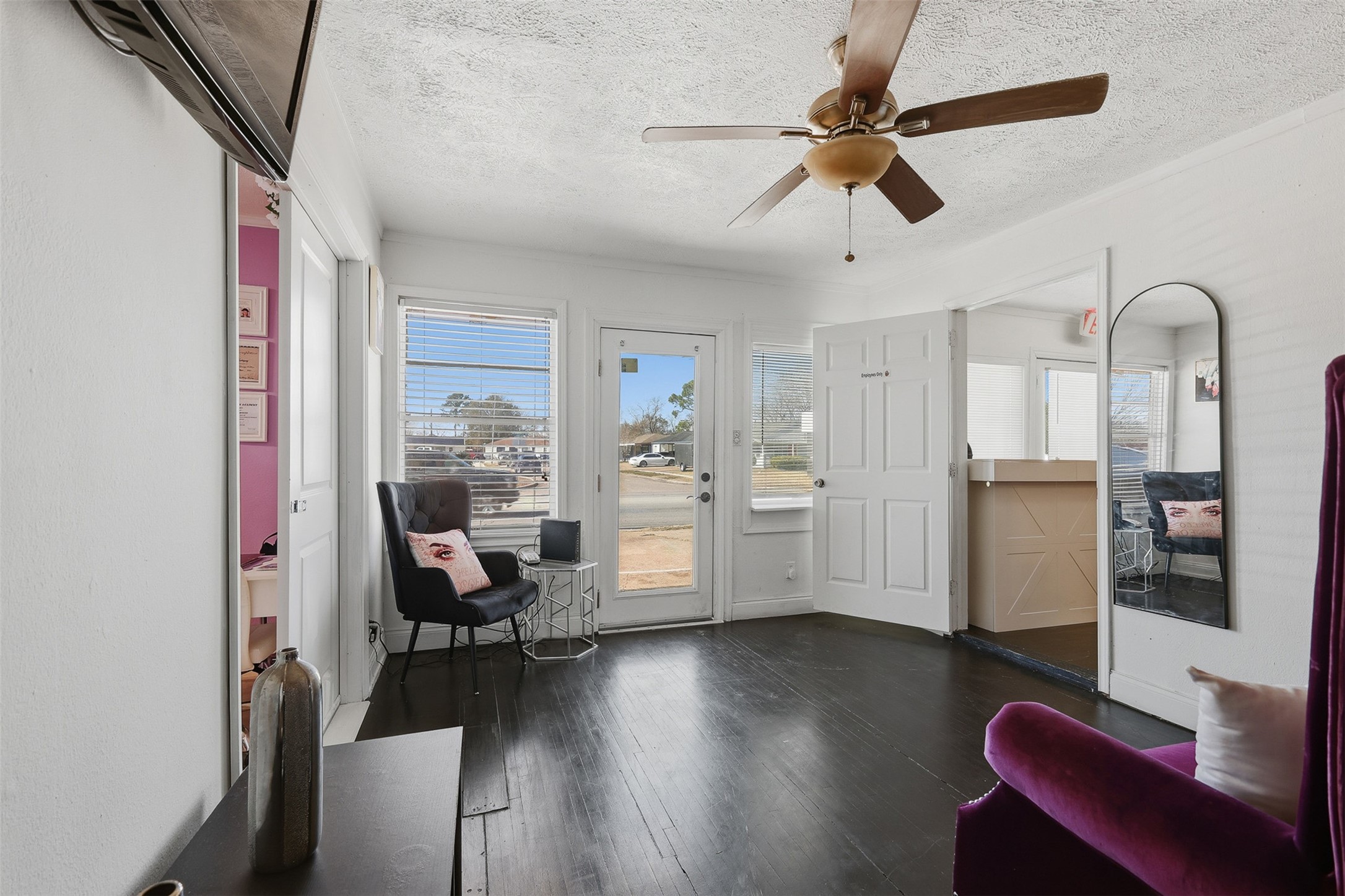 2205 Strawberry Road Pasadena, TX 77502 - Photo 8 of 29 a view of a livingroom with furniture hardwood floor and a ceiling fan