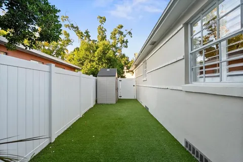 a view of a back yard of the house