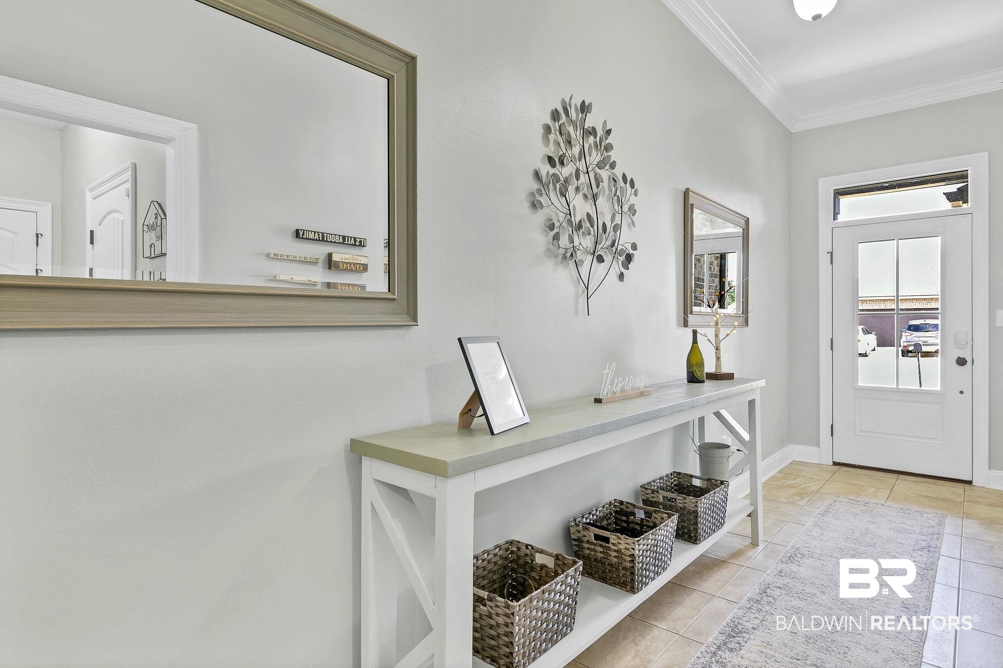30635 Drayton Court Daphne, AL 36527 - Photo 7 of 51 Entryway with crown molding, light tile patterned floors, and baseboards