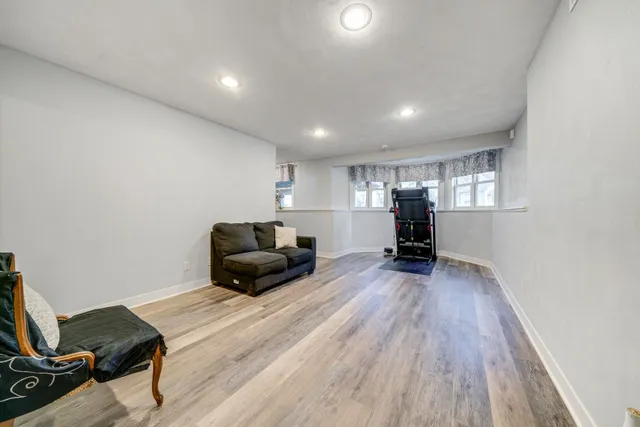 a backyard of a house with yard fire pit and outdoor seating