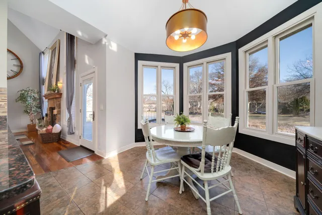 a bathroom with a sink a mirror a vanity and a shower