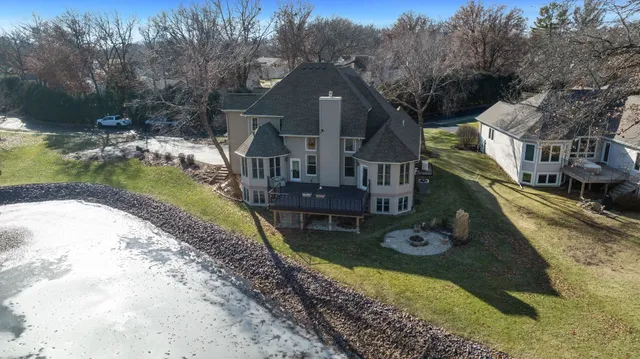a bathroom with a sink a mirror a vanity and a shower