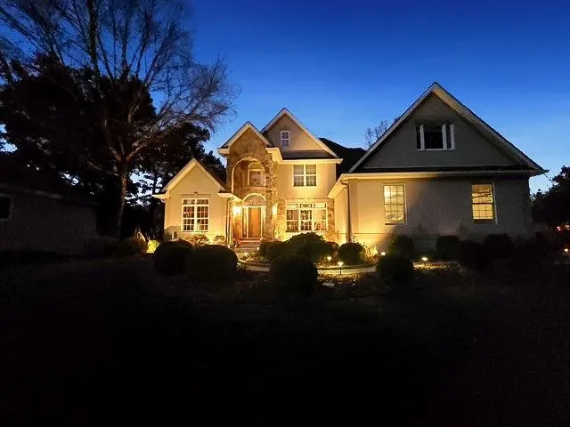 a backyard of a house with yard fire pit and outdoor seating
