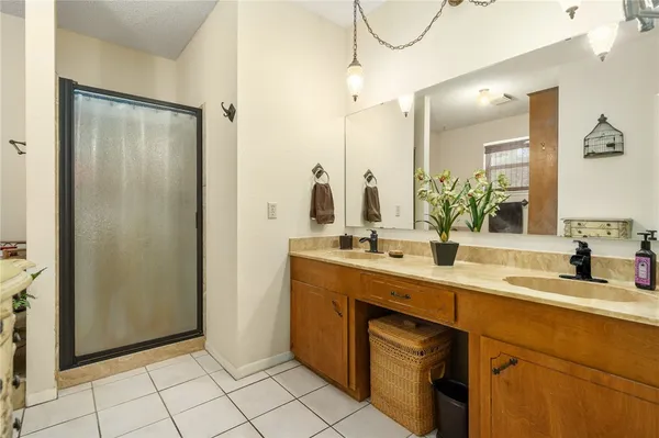 a bathroom with a double vanity sink mirror and