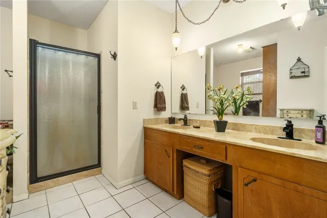 a bathroom with a double vanity sink mirror and