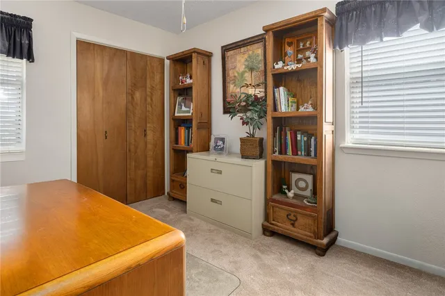 a room with a bed and a cabinets