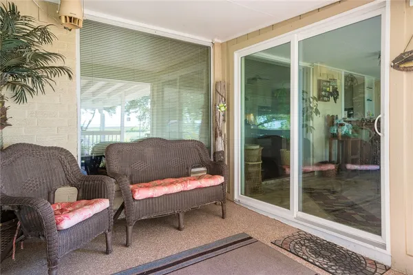 a outdoor living space with furniture and a potted plant