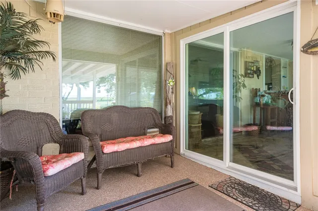 a outdoor living space with furniture and a potted plant