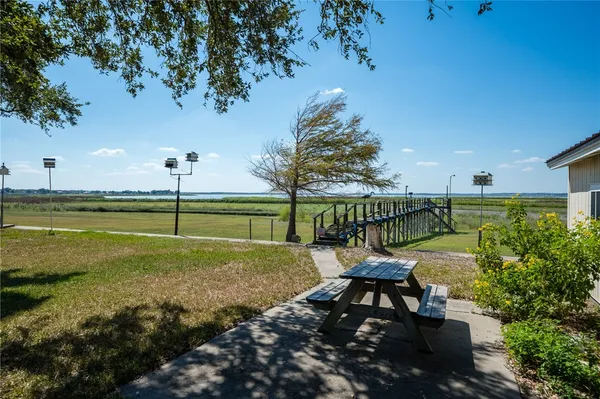 a view of a garden with an outdoor space