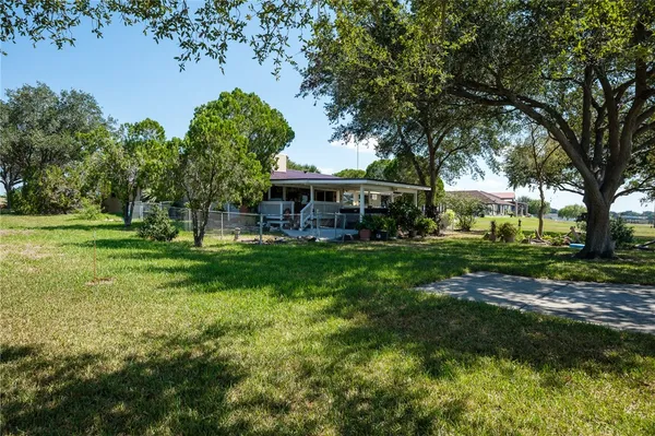a view of a house with a big yard