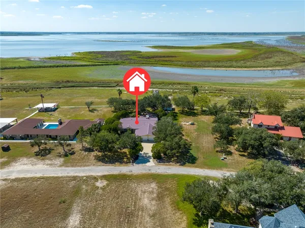 a view of a swimming pool with an outdoor space and seating area
