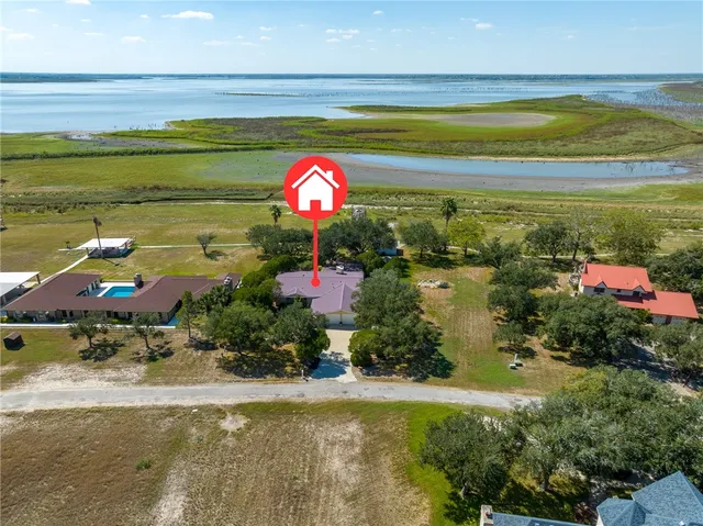 a view of a swimming pool with an outdoor space and seating area