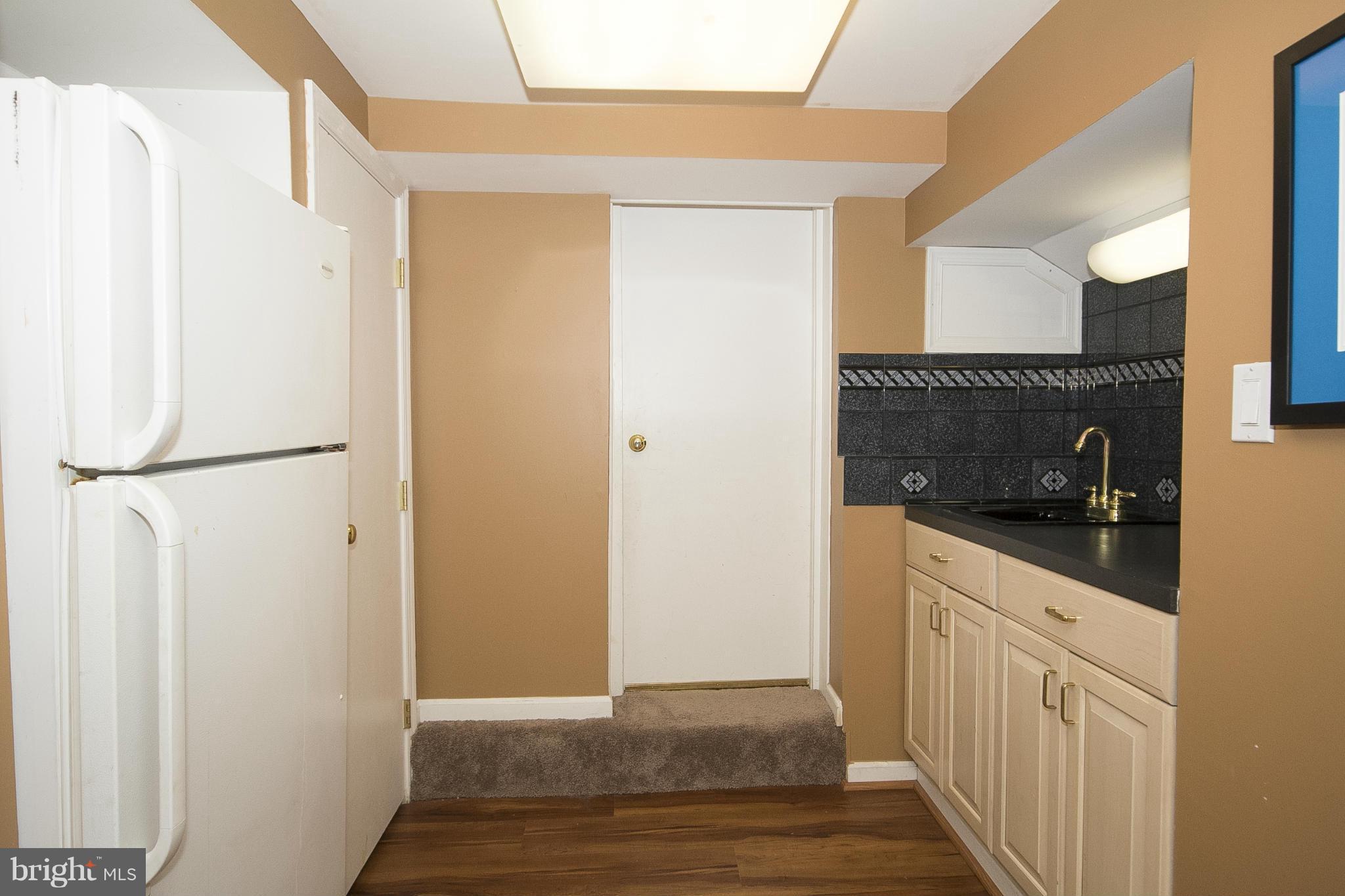 7104 Rich Hill Road Baltimore, MD 21212 - Photo 25 of 30 Wet bar, 2nd fridge off rec room.