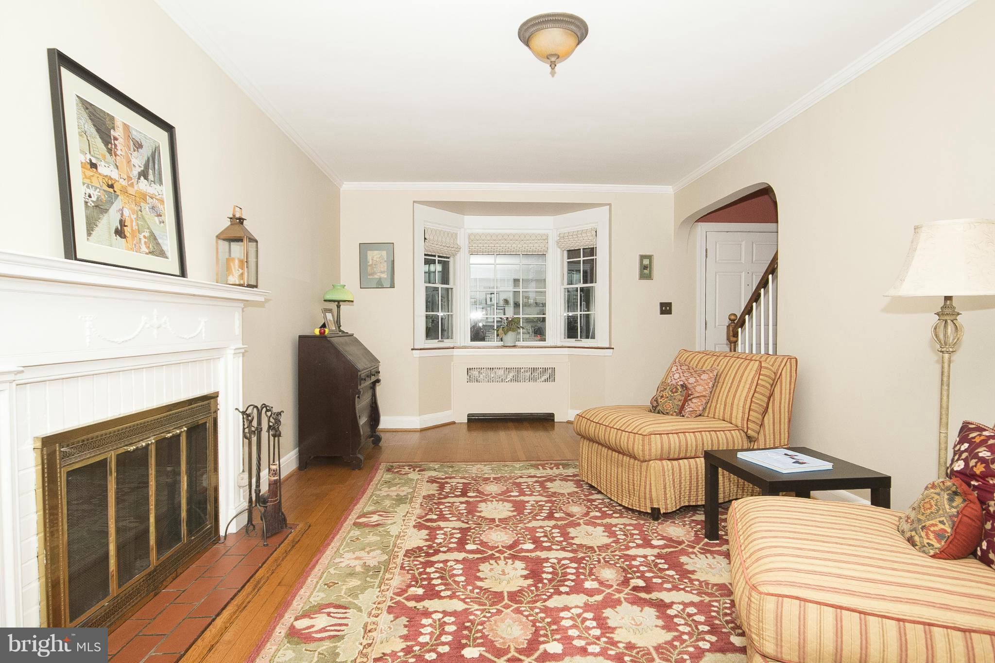 7104 Rich Hill Road Baltimore, MD 21212 - Photo 7 of 30 Living Room with bay window and fireplace.