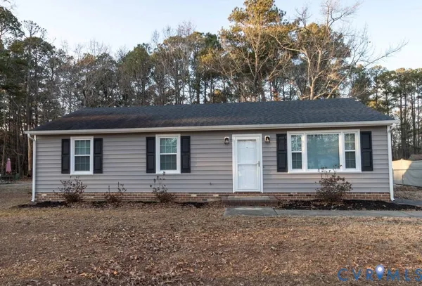 a front view of a house with yard