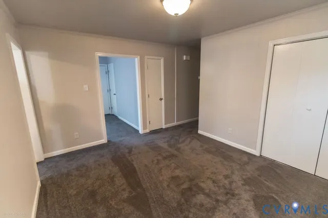 a view of closet area with empty racks