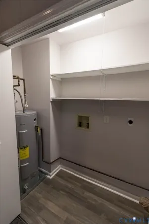 a view of storage and utility room with a window