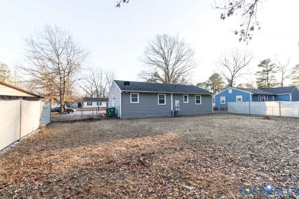 a view of a house with a yard and garage