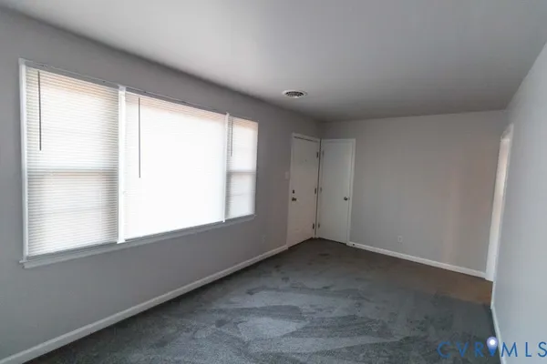 a view of an empty room with a window