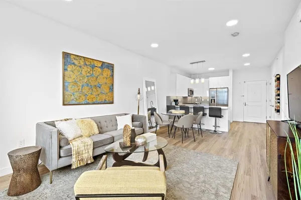 a living room with furniture and a table