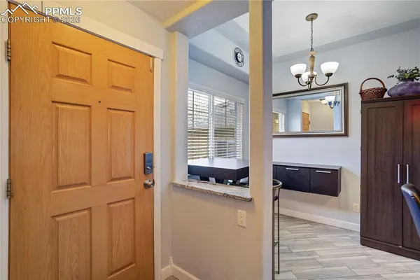 a view of an entryway with wooden floor