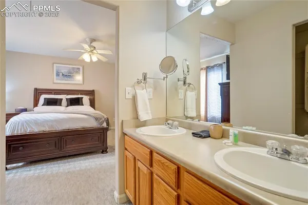 a bathroom with a shower a toilet and a tub