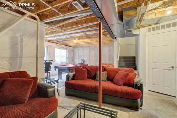 a living room with furniture and a window