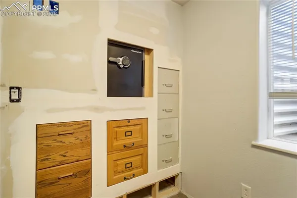 a view of bedroom with a bed and wooden floor