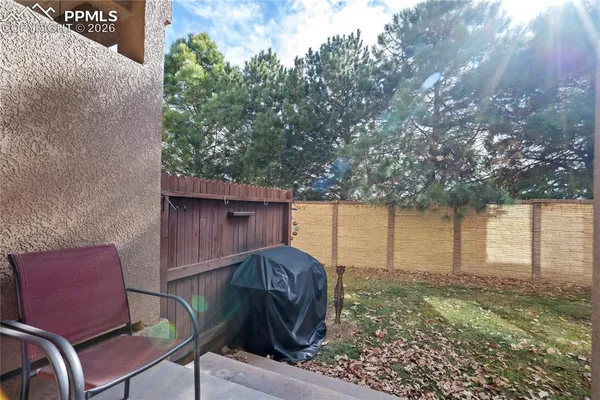 a view of house with backyard