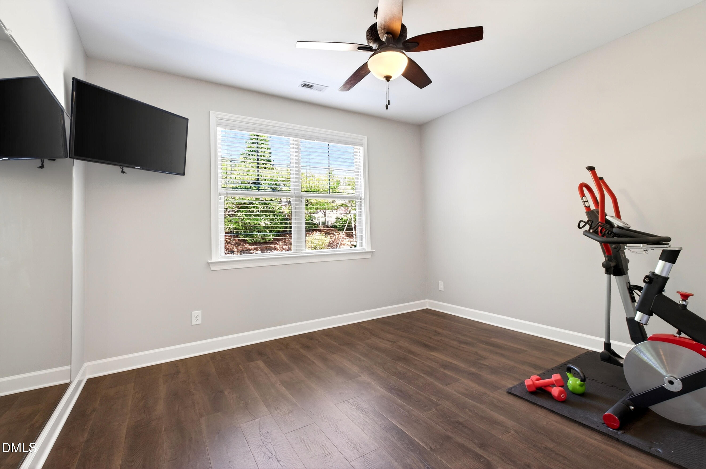 313 Karpen Lane Cary, NC 27519 - Photo 36 of 86 a view of a livingroom with wooden floor and a flat screen tv
