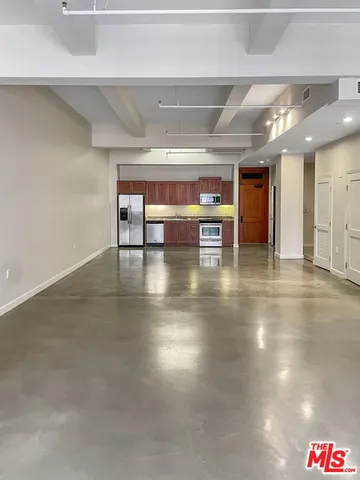 an empty room with wooden floor