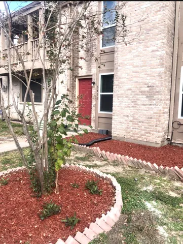 a view of a backyard of the house